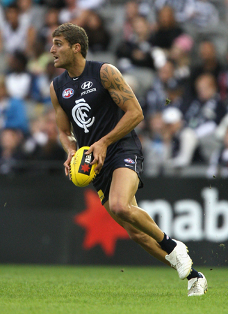 Paul Bower goes for a dash in the 2009 NAB Cup Semi Final against Geelong.