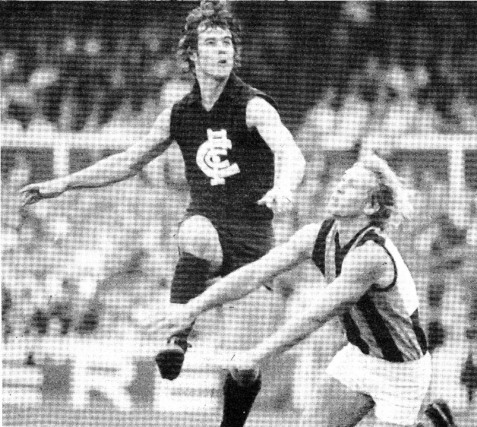 Peter Hall kicks against Hawks.