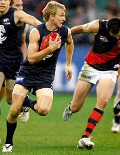 Dennis Armfield streaks away with the football against Essendon.